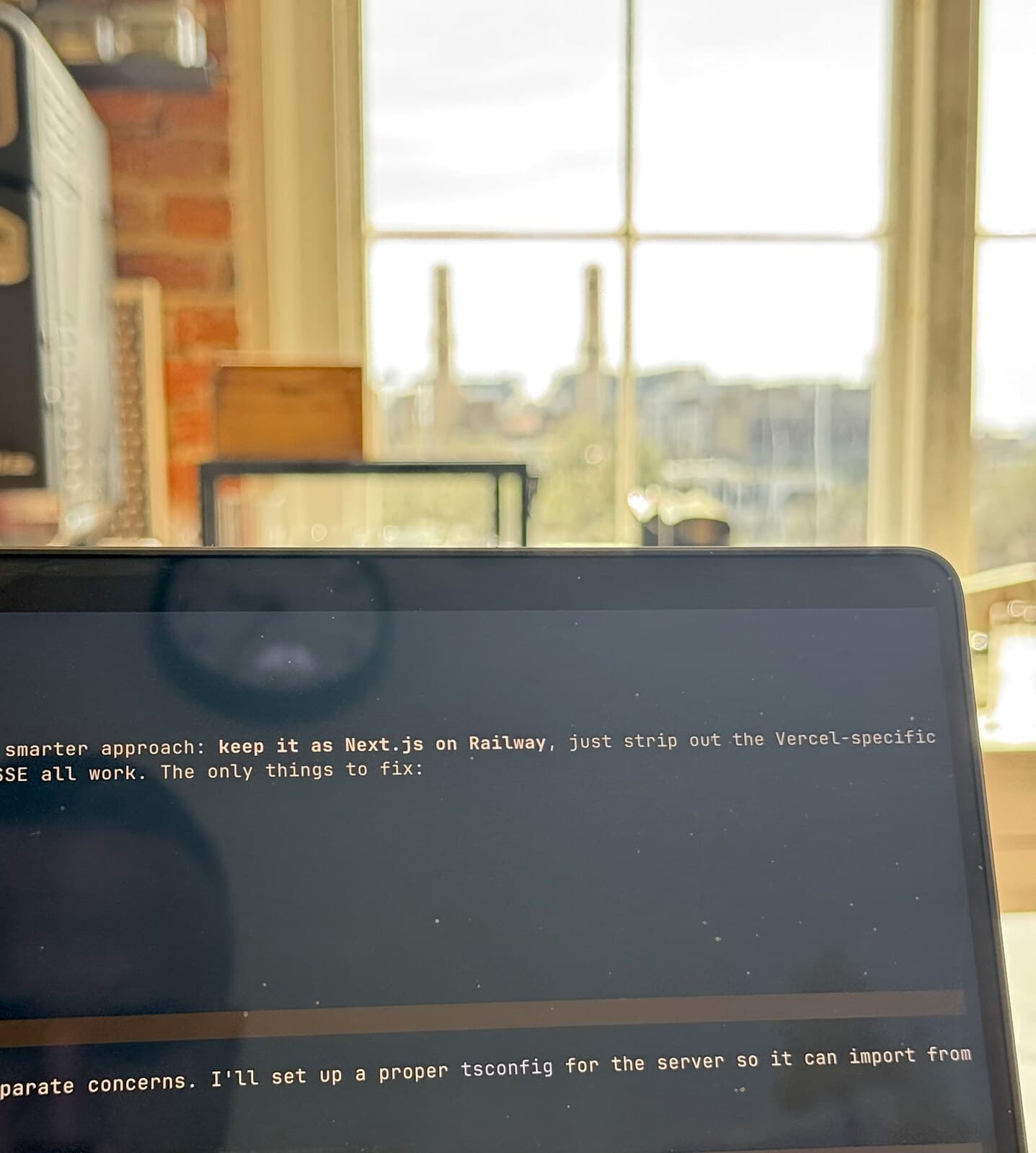 A laptop on a desk showing an AI agent transcript
